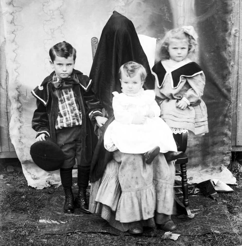The Mathers children of Schultz, West Virginia, photographed with their "hidden mother." From the Albert Ewing Collection via Ohio Memory.