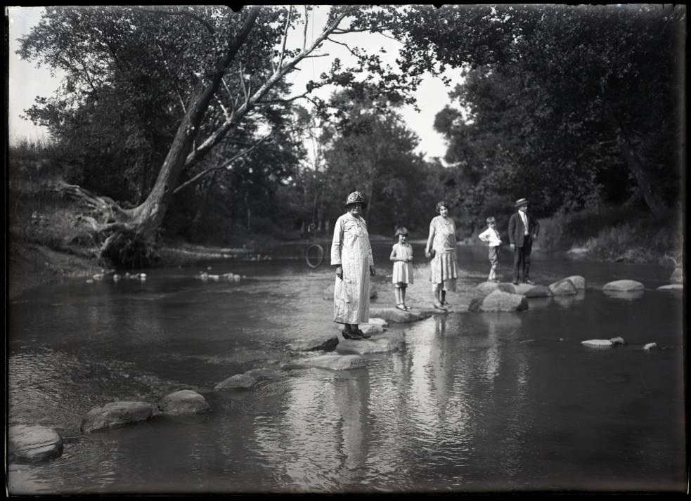Members of the Kinley family standing on stepping stones across the Sandusky River, ca. 1925. Via Ohio Memory. 