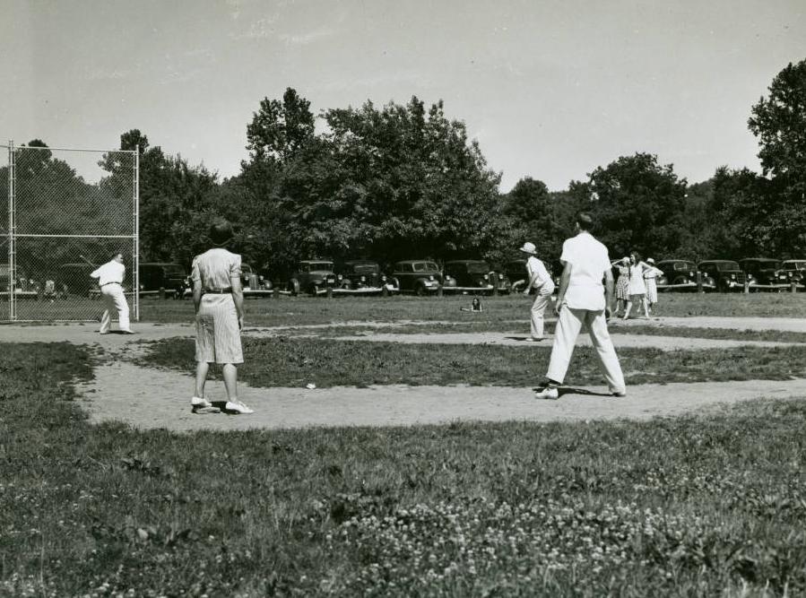 Men and women playing baseball, ca. 1940, via the Ohio Guide Collection on Ohio Memory.
