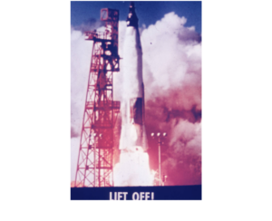 The Friendship 7 spacecraft lifts off from the launch pad with fire and exhaust